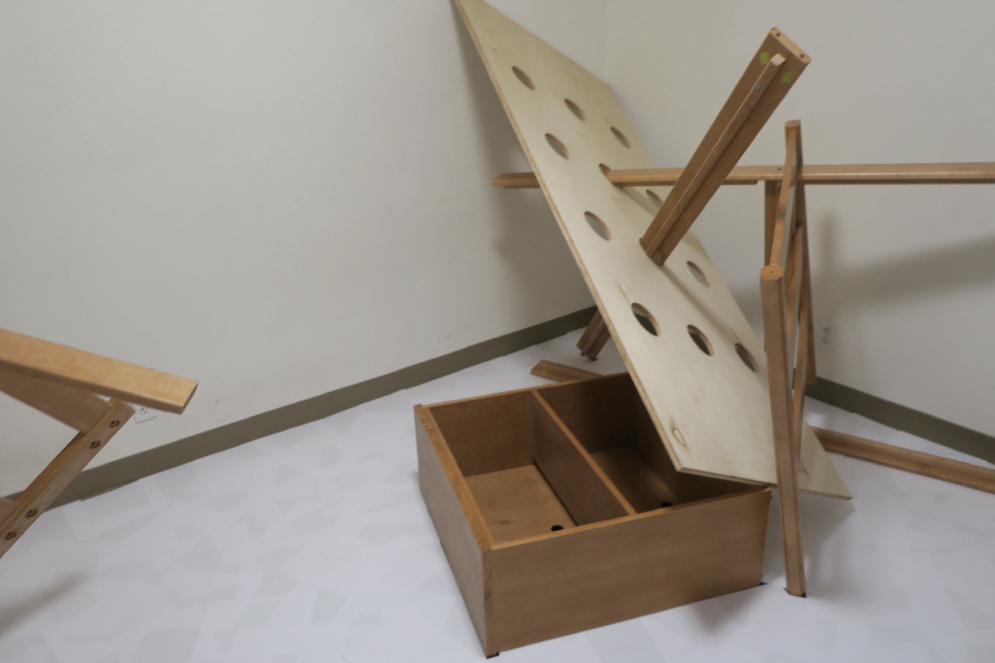 2: A Monument, 2023 — detail view, an open drawer beneath a leaning headboard
