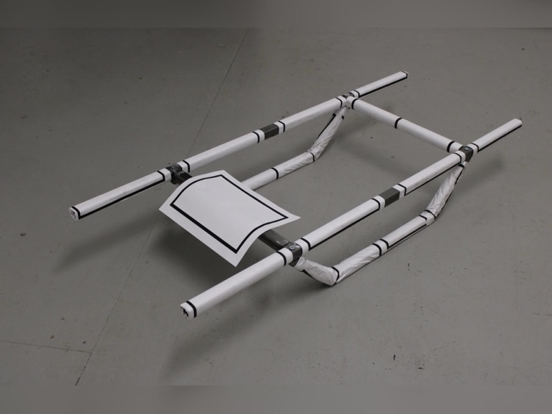 Confinement, 2026 — welded steel frame wrapped in blank shiva mourning notices