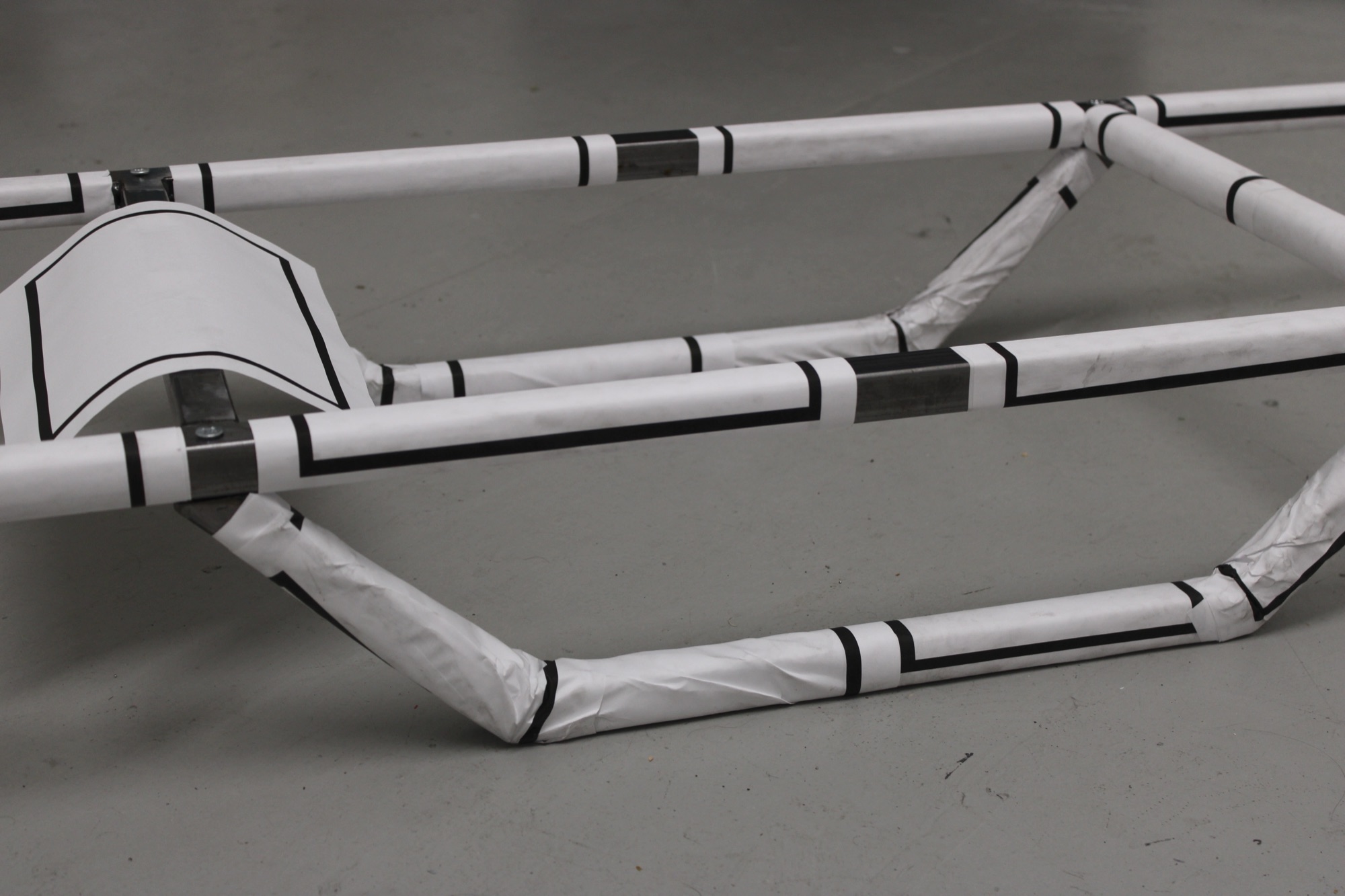 Confinement, 2026 — detail view, steel showing through where the paper does not reach